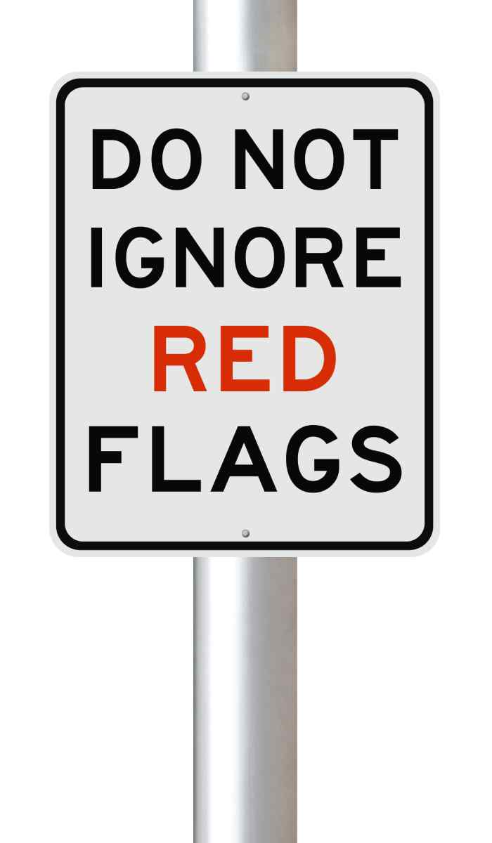 A sign that reads “do not ignore red flags”