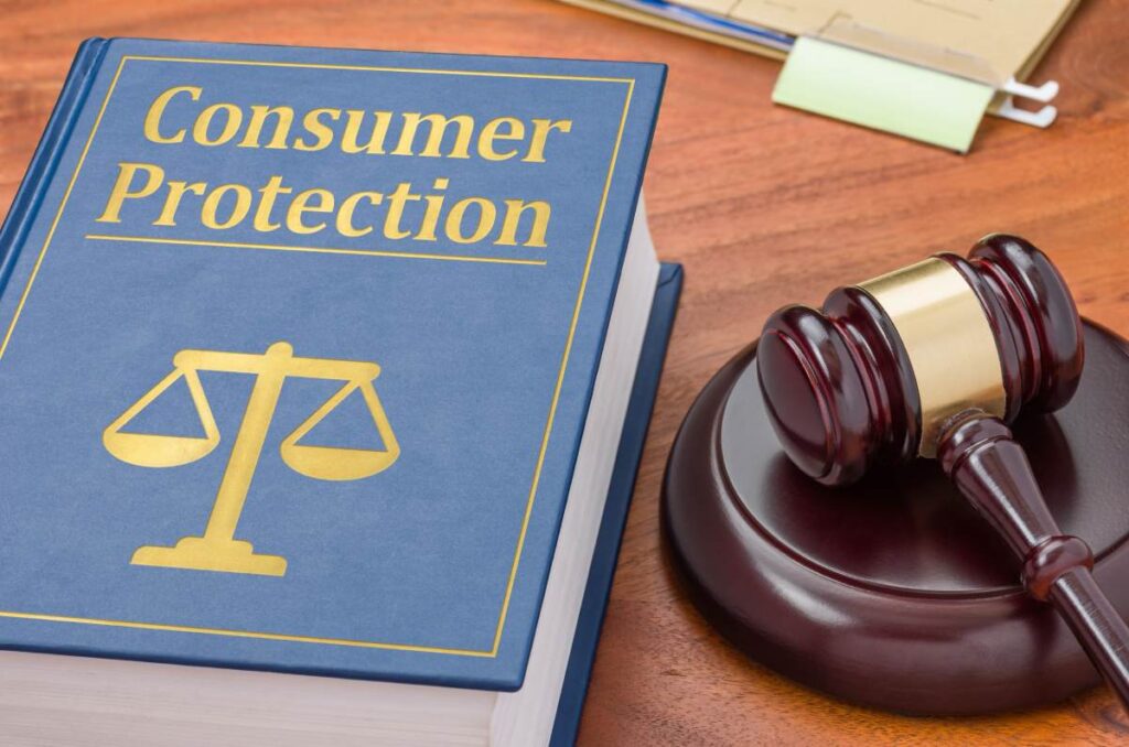 Book with “consumer protection” written on the front next to a gavel